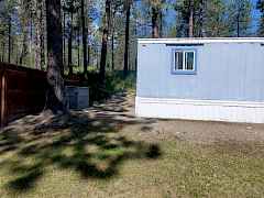 back of home with small storage unit back of home with small storage unit